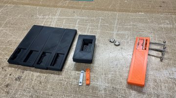 The finished Ice Vice next to some components and prototypes